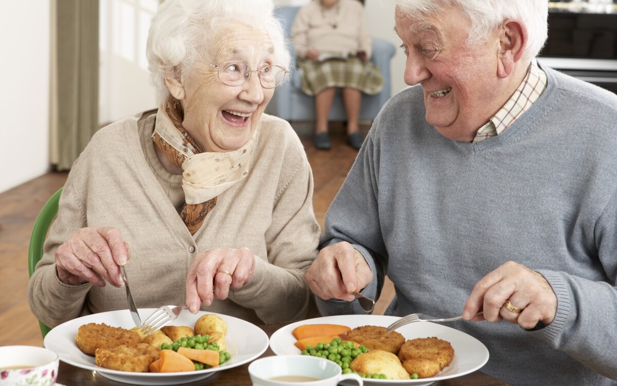 2194429-senior-couple-enjoying-meal-together.jpg