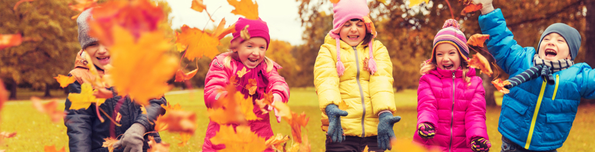 16949970-happy-children-playing-with-autumn-leaves-in-park.jpg