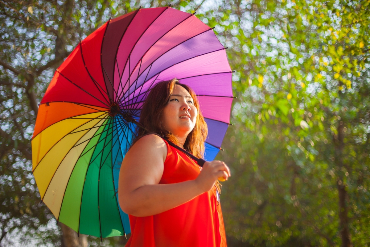 19196492-happy-fatty-woman-with-umbrella (1).jpg