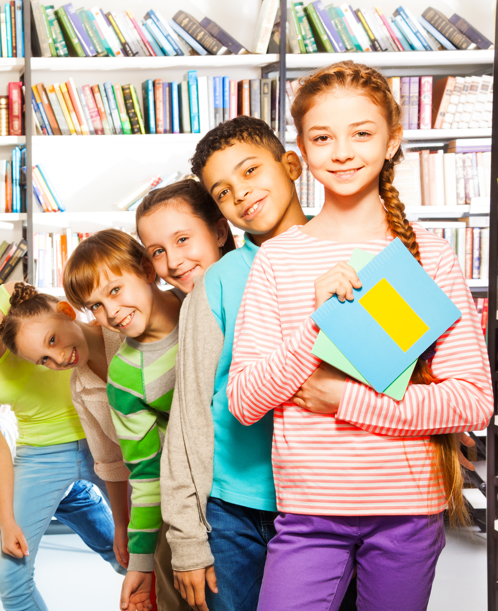 mp8897965-happy-kids-standing-in-row-inside-library.jpg